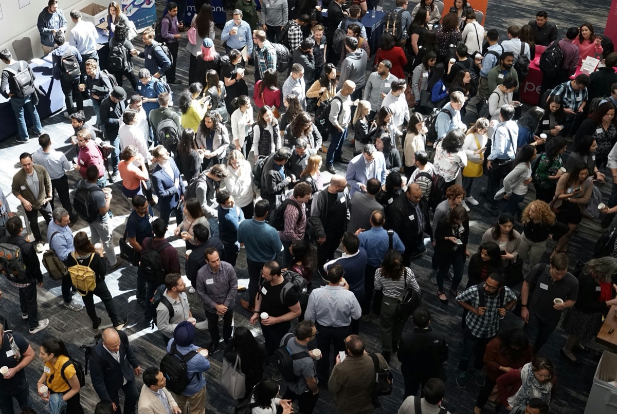 Delegates networking at a conference